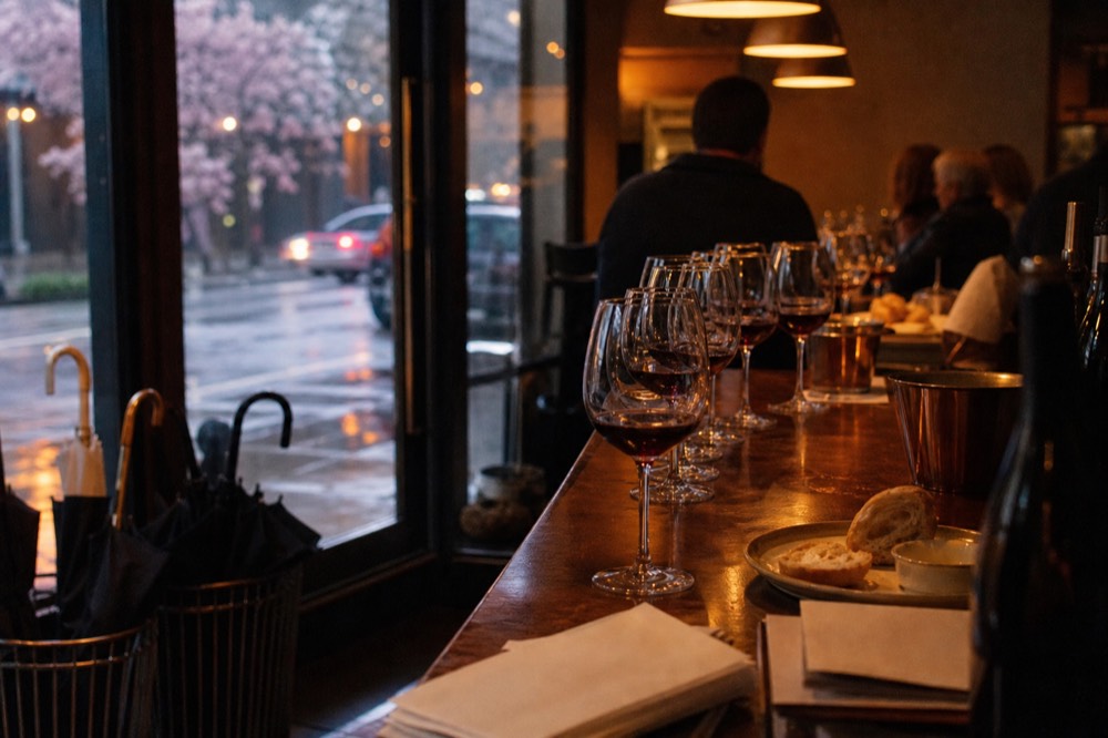 A tasting flight of red wines on a winery bar in the Dundee Hills