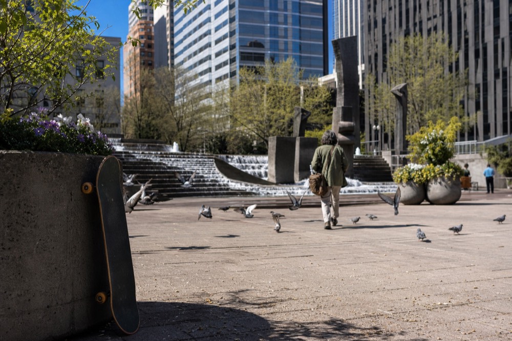 Downtown Portland street with public art and fountain