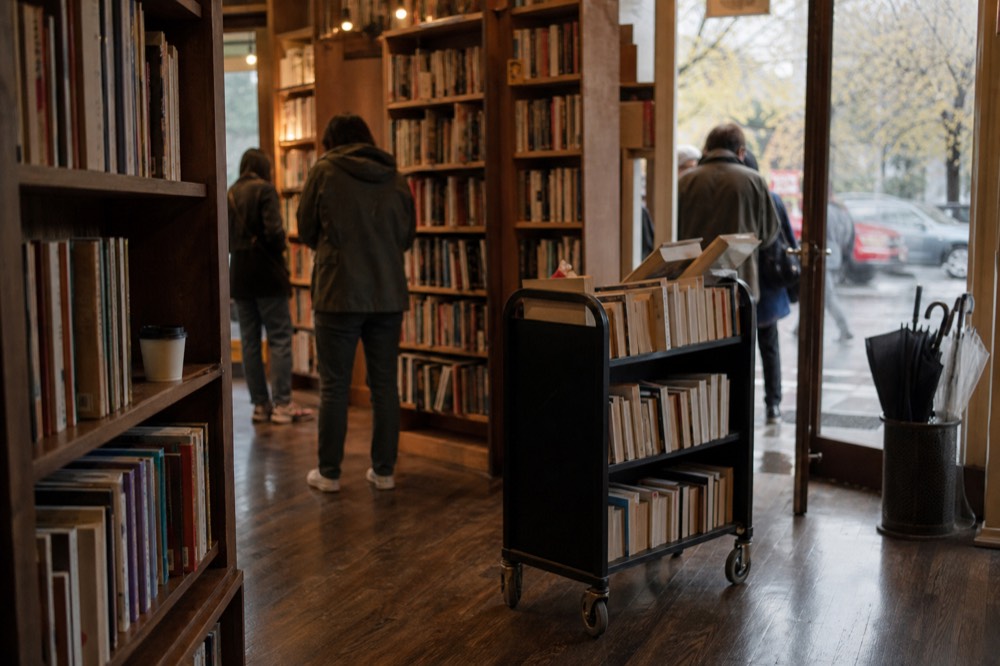 Powell's City of Books interior with tall shelves and readers